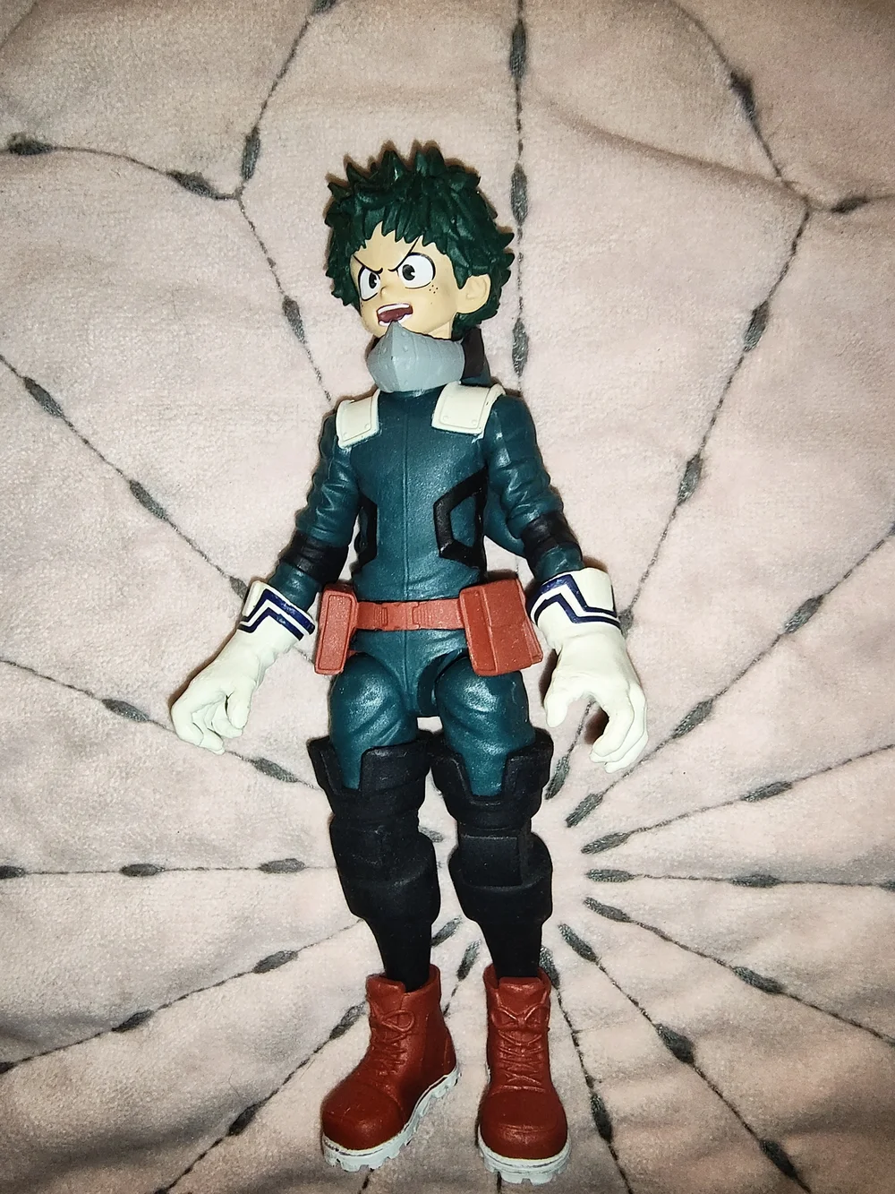 Green and Red Superhero Action Figure with White Gloves